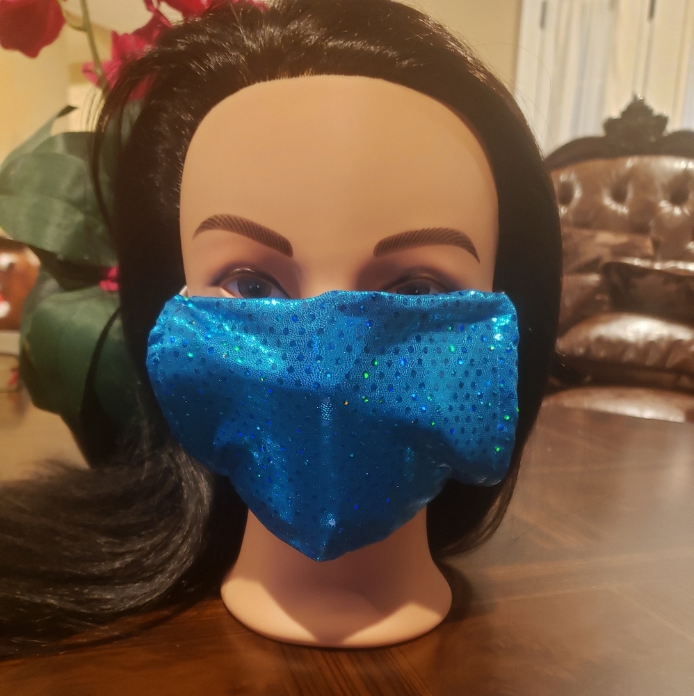 Turquoise sequin face mask.